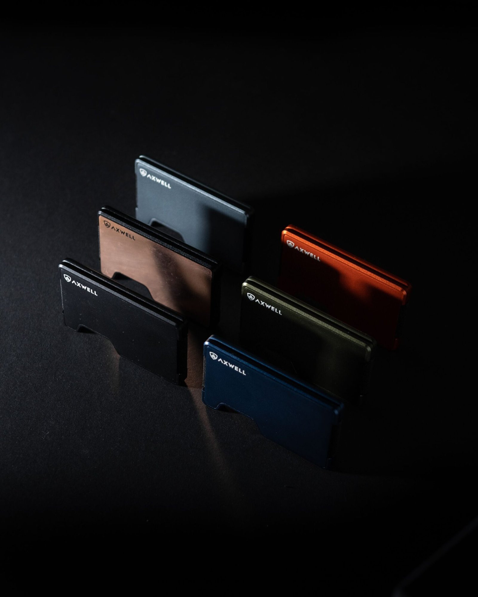 Showcase of minimalist aluminum wallets elegantly arranged for modern everyday carry enthusiasts.